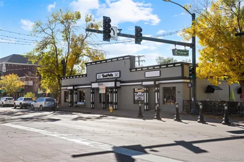 a front view of a building and a umbrellas