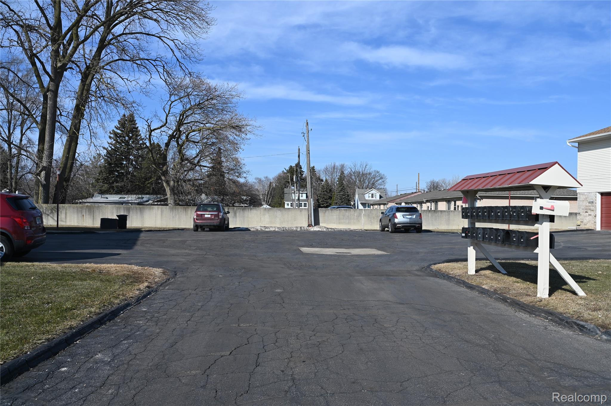 31056 Richert Street, Unit 8 Fraser, MI 48026 - Photo 4 of 19 View of asphalt street and parking behind condo