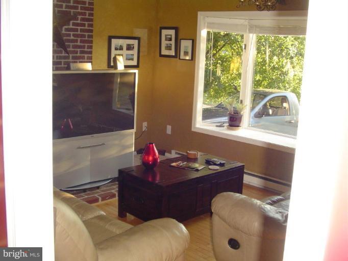 223 Killdeer Road Stephens City, VA 22655 - Photo 10 of 15 a living room with furniture and a window