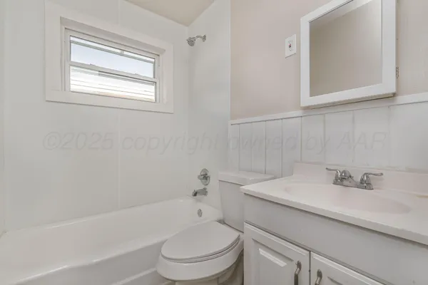 a bathroom with a sink toilet and bathtub