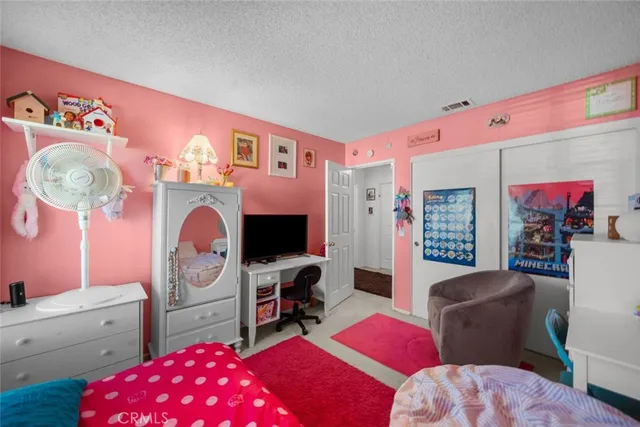 a bedroom with furniture and a bed