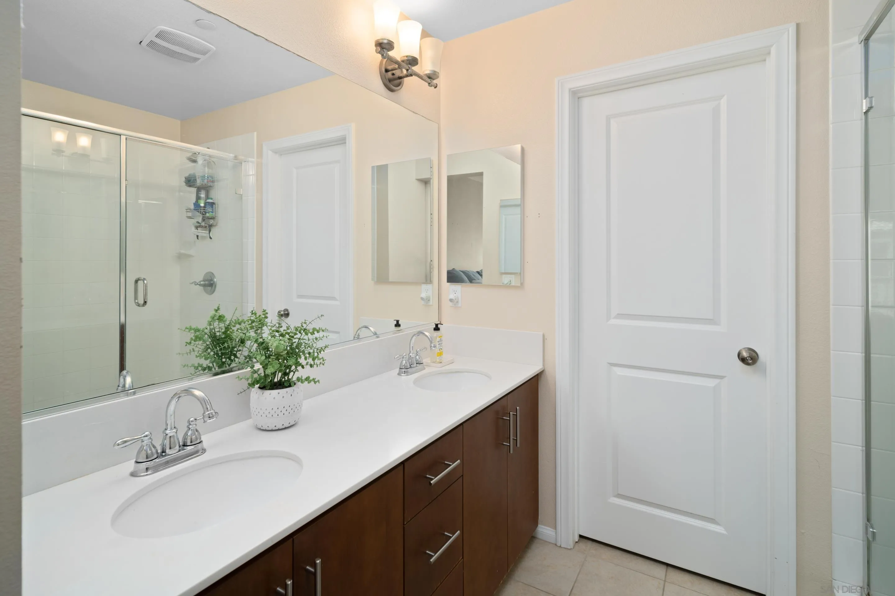 1879 Black Mustard Lane Carlsbad, CA 92011 - Photo 12 of 24 a bathroom with a double vanity sink and mirror