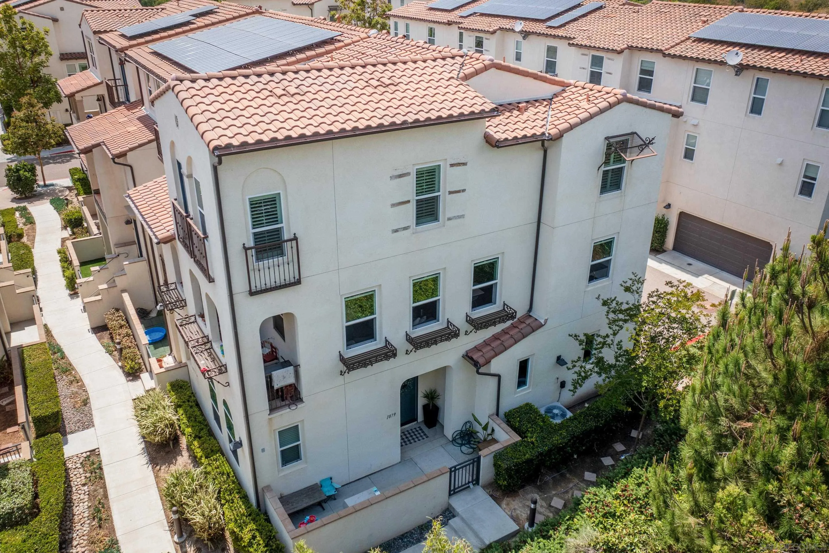 1879 Black Mustard Lane Carlsbad, CA 92011 - Photo 4 of 24 a front view of a multi story residential apartment building