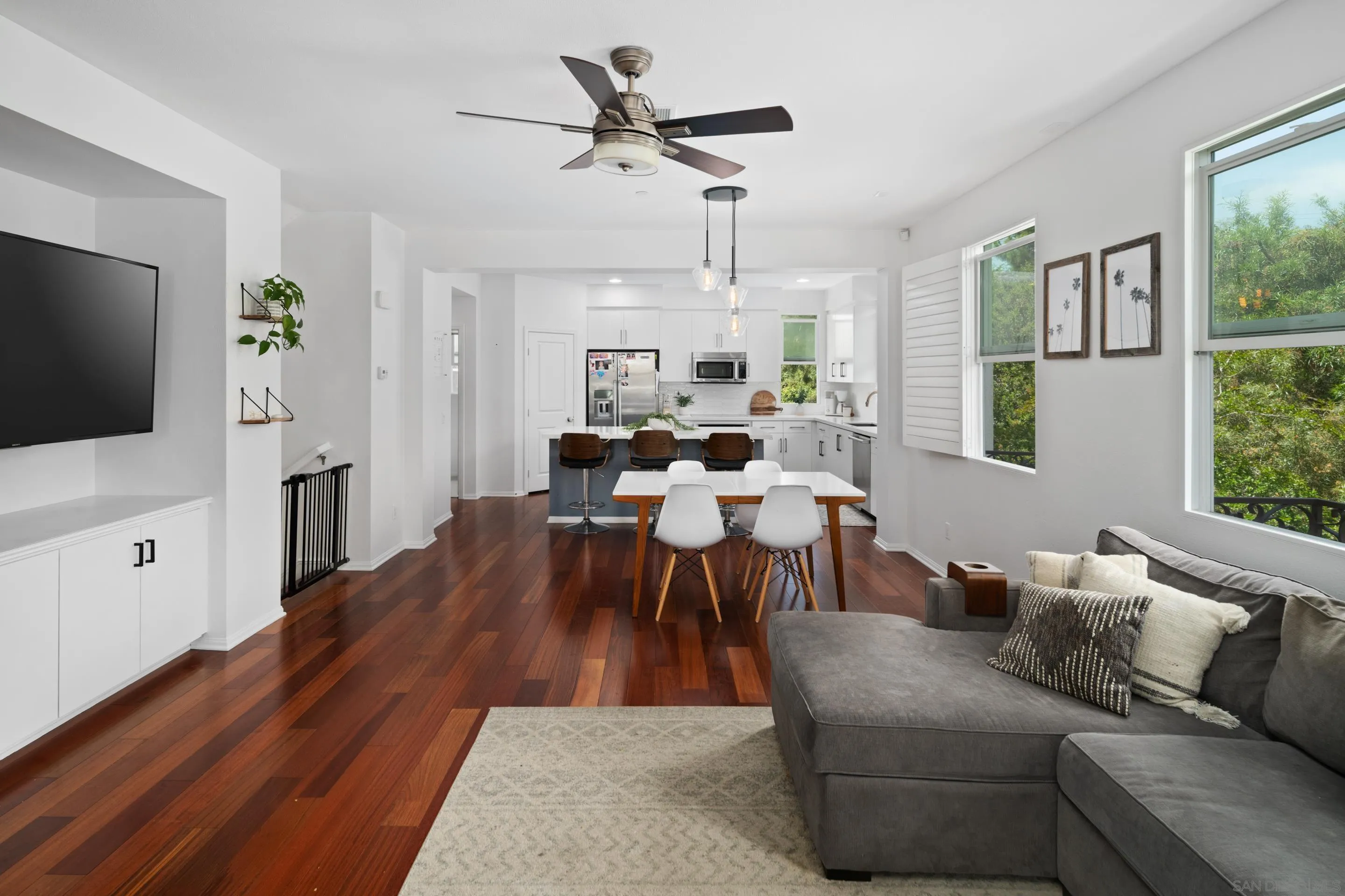 1879 Black Mustard Lane Carlsbad, CA 92011 - Photo 5 of 24 a living room with furniture a flat screen tv and a large window