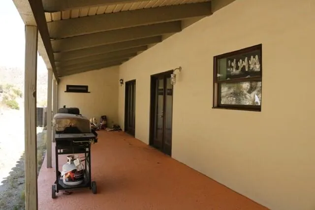 a hallway with a view of living room