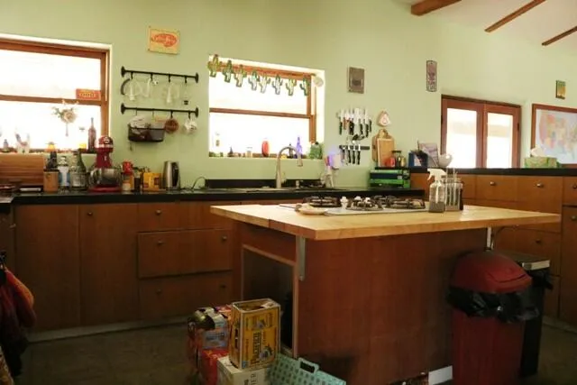 a kitchen with a sink cabinets and window