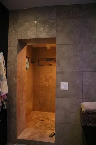 a bathroom with a bath tub and shower