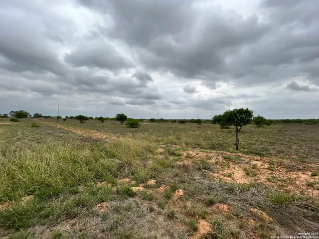 a view of a large body of water with lots of buildings in background