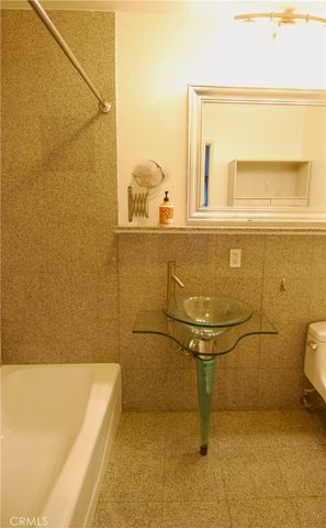 a bathroom with a sink and a shower