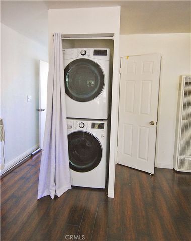 a view of hallway with wooden floor