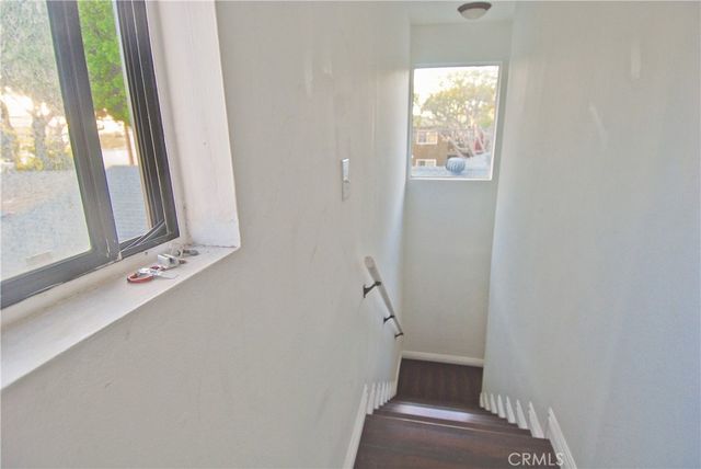 a view of an entryway with wooden floor