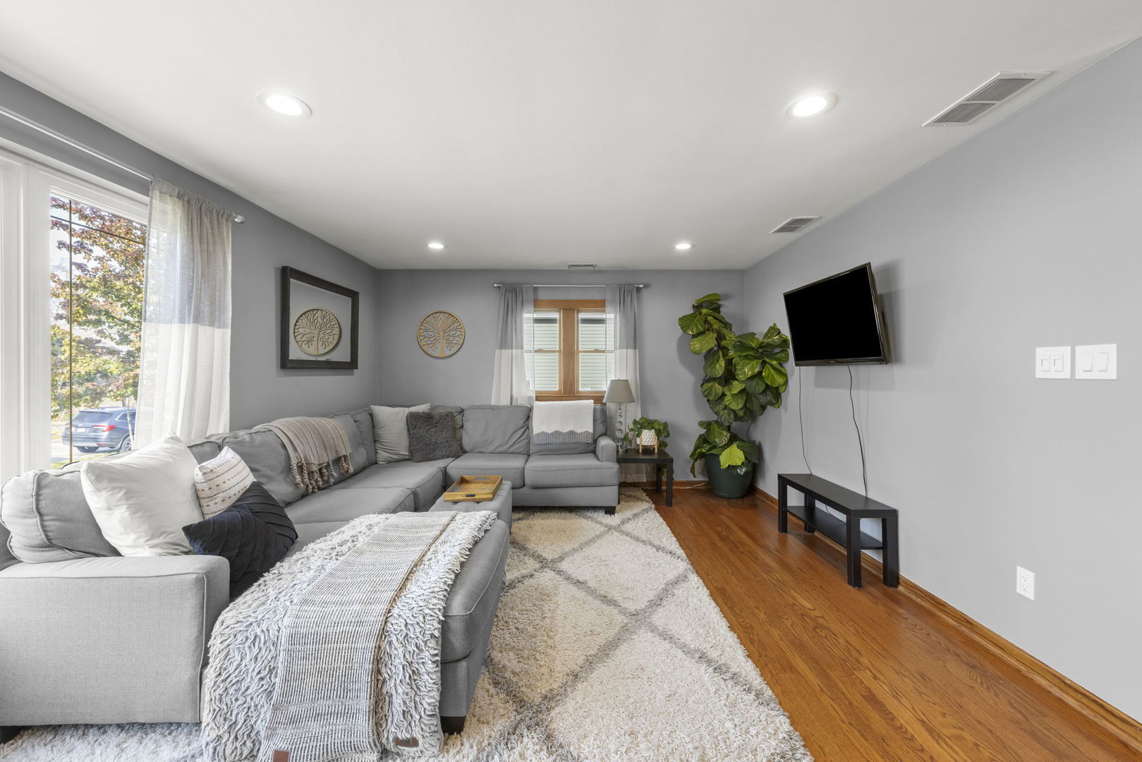 521 Lindley Road Westmont, IL 60559 - Photo 7 of 30 a living room with furniture and a flat screen tv