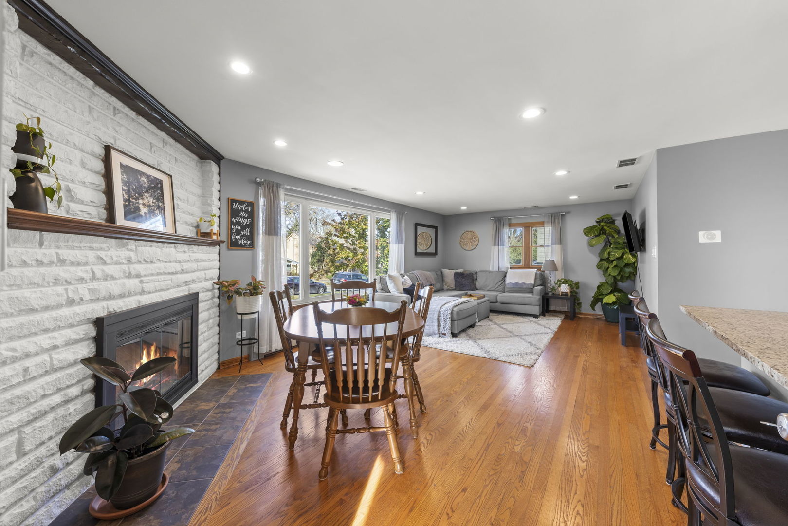 521 Lindley Road Westmont, IL 60559 - Photo 9 of 30 a living room with furniture a fireplace and a table