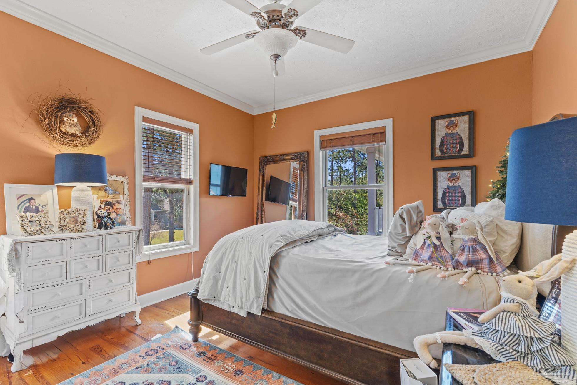 5460 North Shore Road Pensacola, FL 32507 - Photo 27 of 49 a bedroom with a bed and dresser with chair