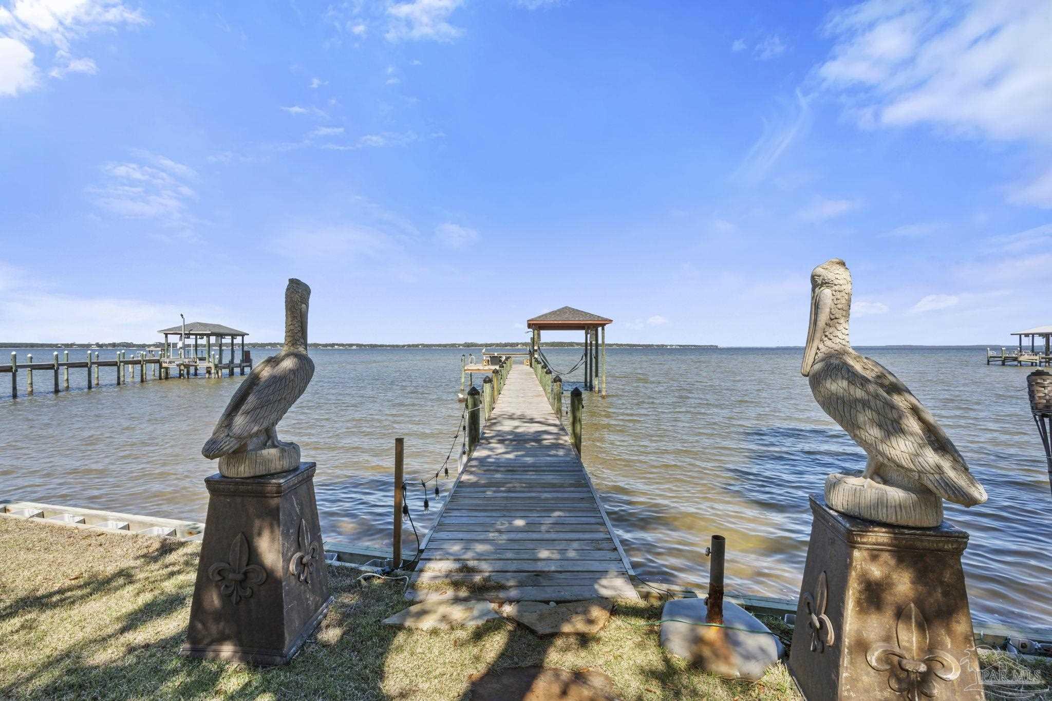 5460 North Shore Road Pensacola, FL 32507 - Photo 32 of 49 a view of a balcony with an ocean