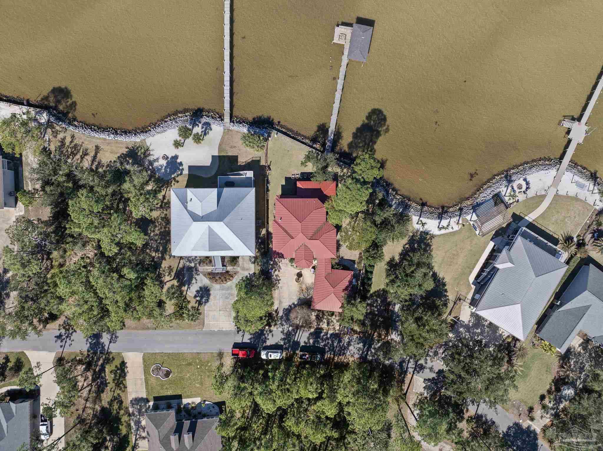 5460 North Shore Road Pensacola, FL 32507 - Photo 37 of 49 an aerial view of a house with a swimming pool