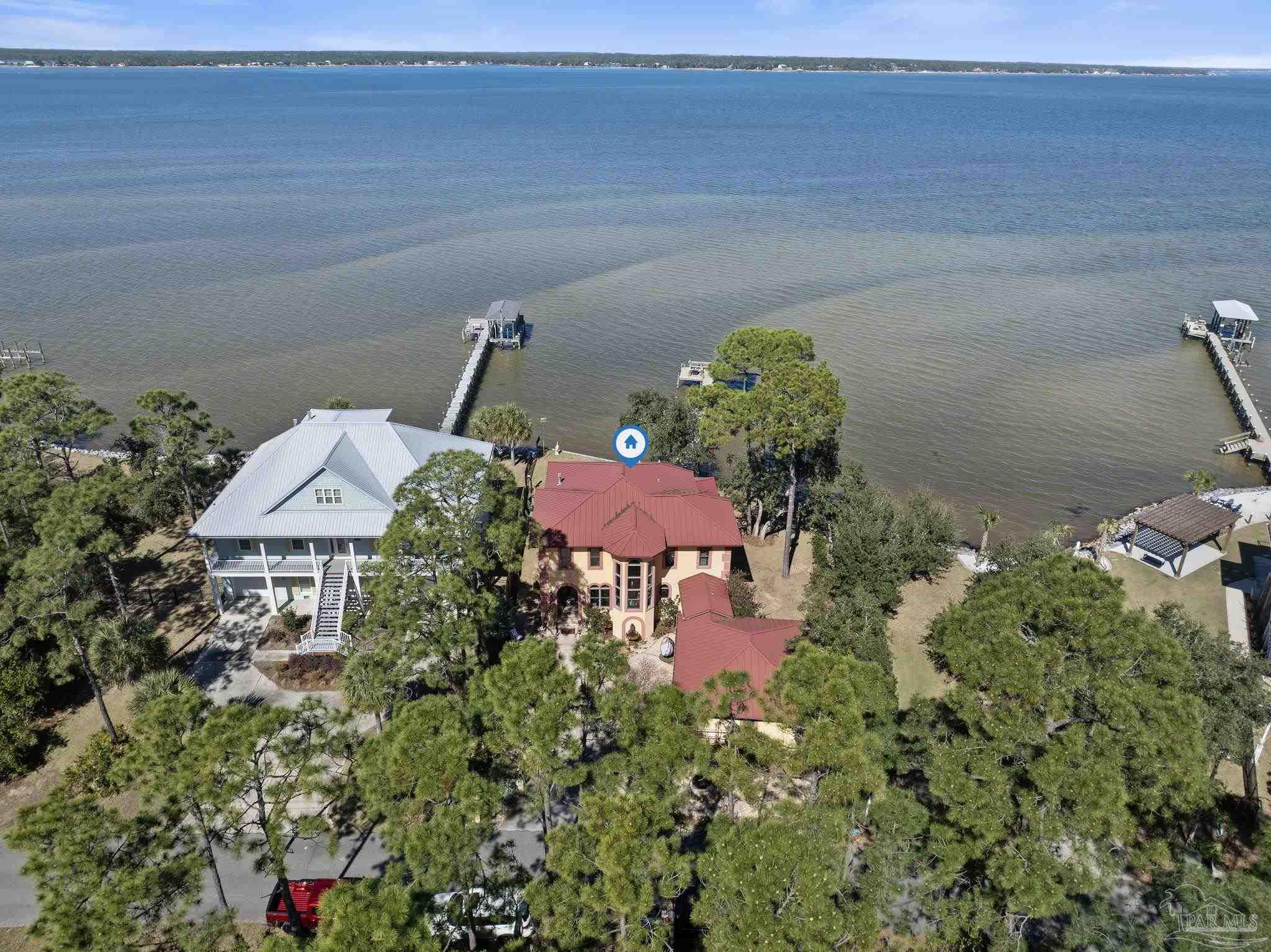 5460 North Shore Road Pensacola, FL 32507 - Photo 38 of 49 a view of a house with a yard and sitting area