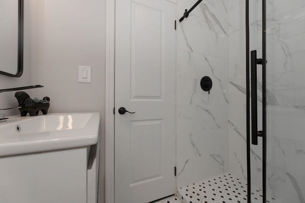 1072 Sayre Road South Union, NJ 07083 - Photo 15 of 31 a bathroom with a shower and a sink