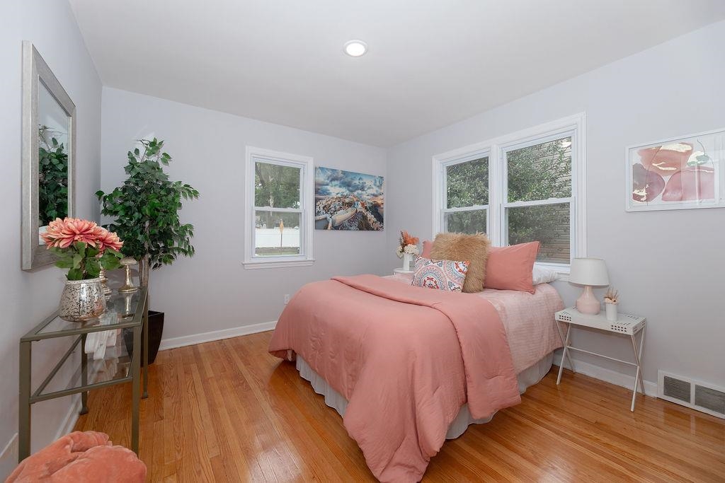 1072 Sayre Road South Union, NJ 07083 - Photo 16 of 31 a bedroom with a bed and a potted plant