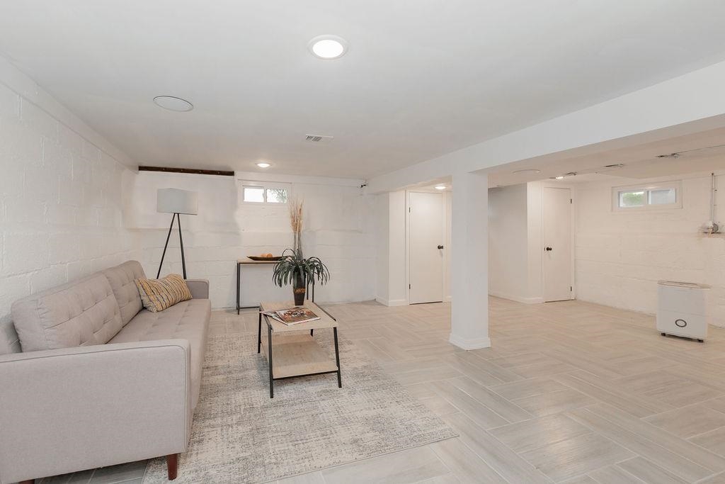 1072 Sayre Road South Union, NJ 07083 - Photo 25 of 31 a living room with furniture and a chandelier