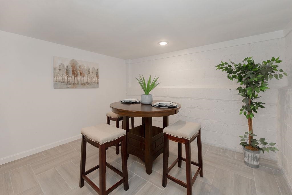1072 Sayre Road South Union, NJ 07083 - Photo 27 of 31 a view of a dining room with furniture and a potted plant