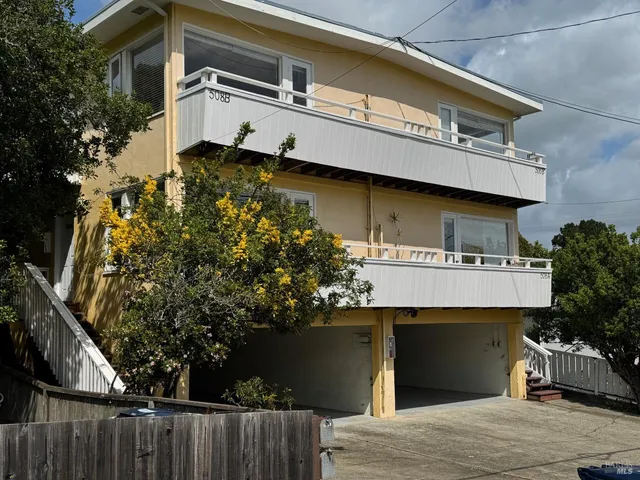 a front view of a house with a garage