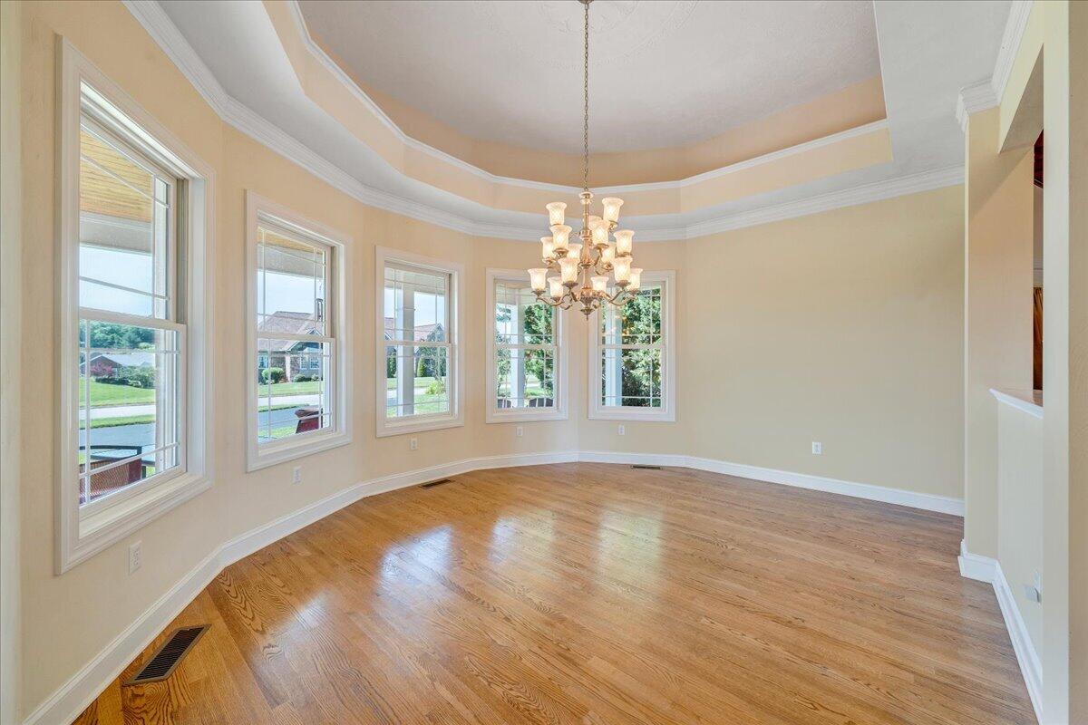 625 Frontier Way Fincastle, VA 24090 - Photo 30 of 105 a view of an empty room with wooden floor and a window