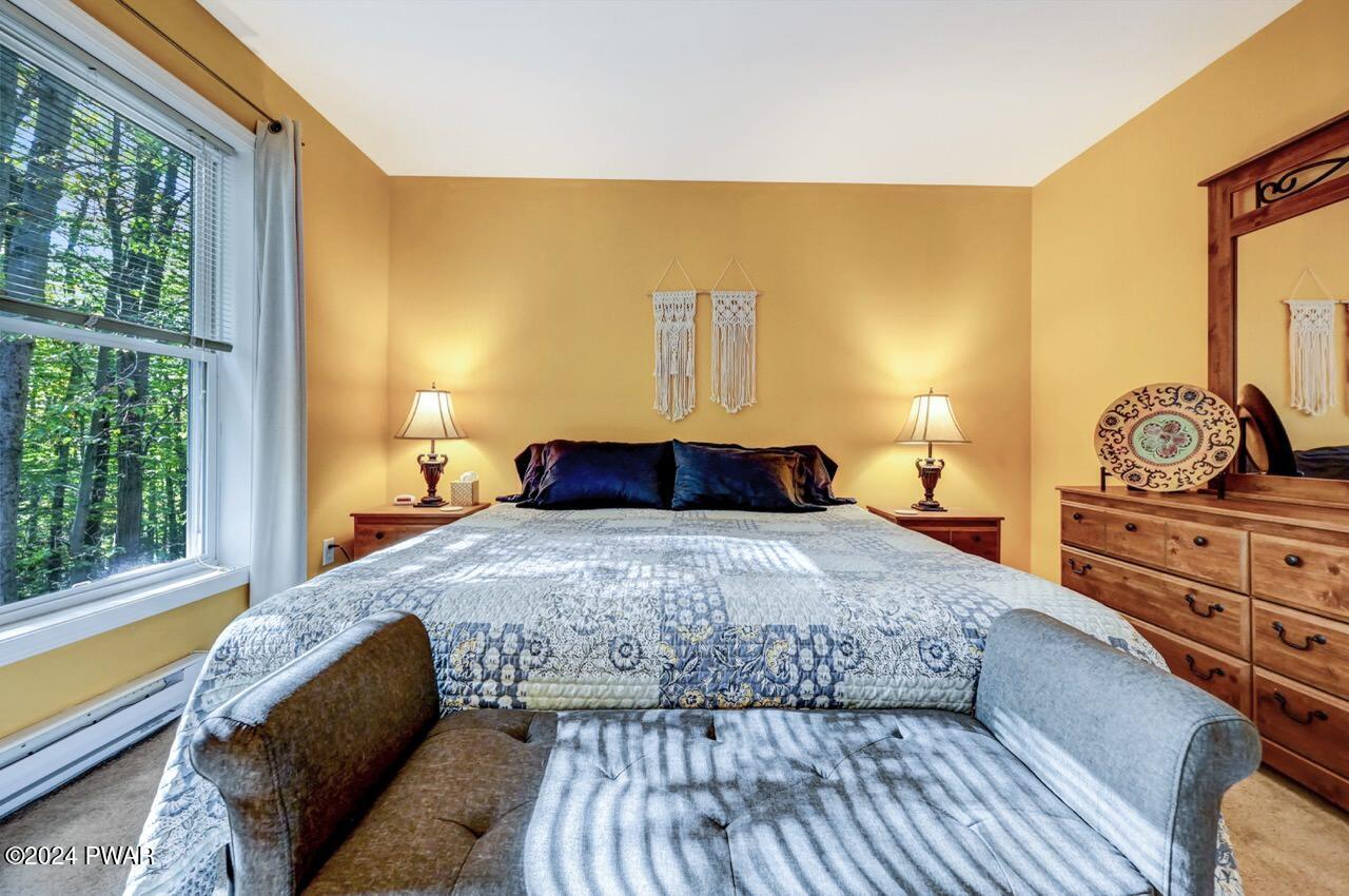 3295 Northgate Road Lake Ariel, PA 18436 - Photo 28 of 111 a bedroom with a bed and wooden floor