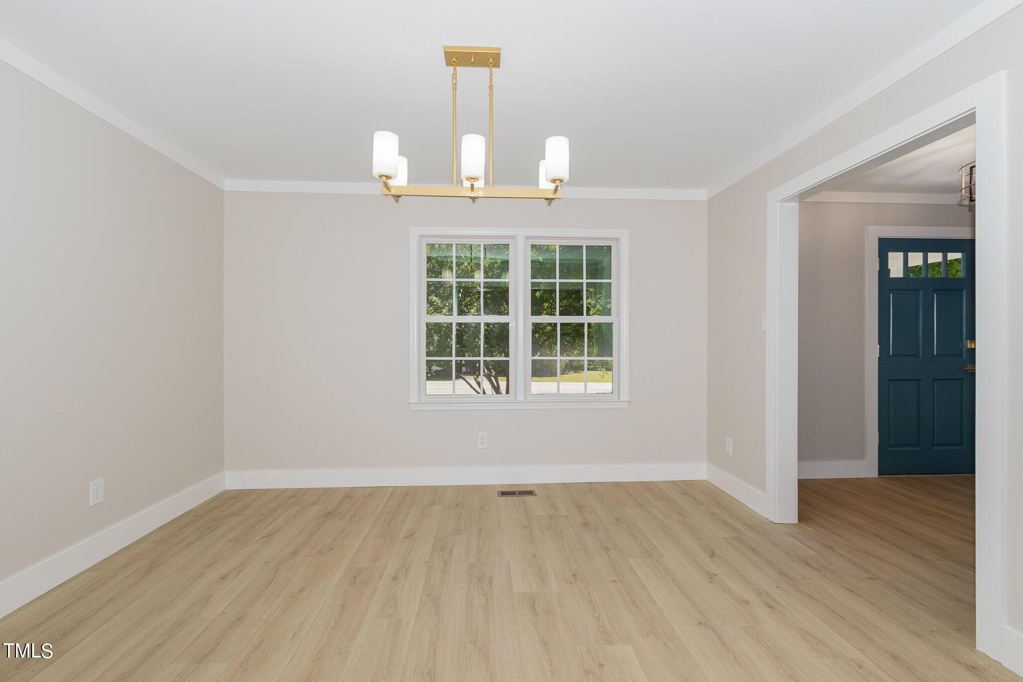 2008 Umstead Road Durham, NC 27712 - Photo 13 of 34 an empty room with wooden floor cabinet and windows