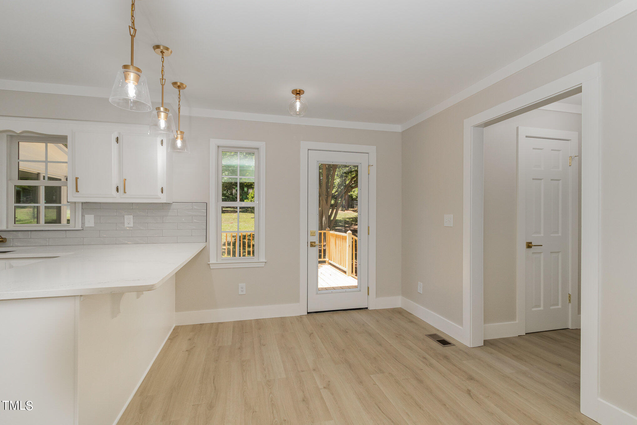 2008 Umstead Road Durham, NC 27712 - Photo 16 of 34 an empty room with wooden floor and windows