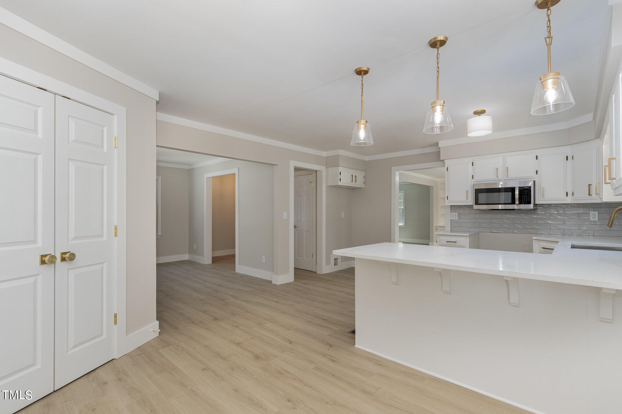 2008 Umstead Road Durham, NC 27712 - Photo 17 of 34 a view of a kitchen with stainless steel appliances granite countertop a refrigerator a sink and a stove