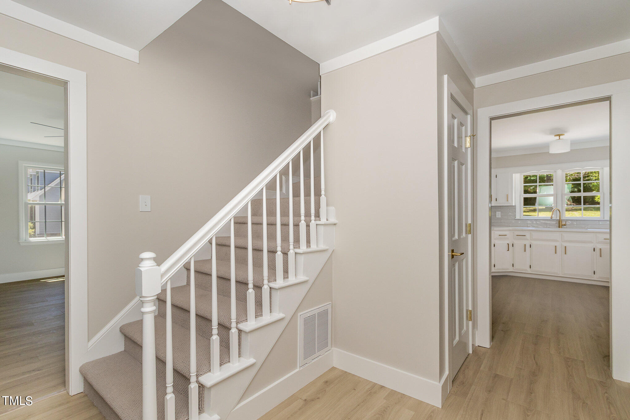 2008 Umstead Road Durham, NC 27712 - Photo 19 of 34 a view of front door with hallway and wooden floor