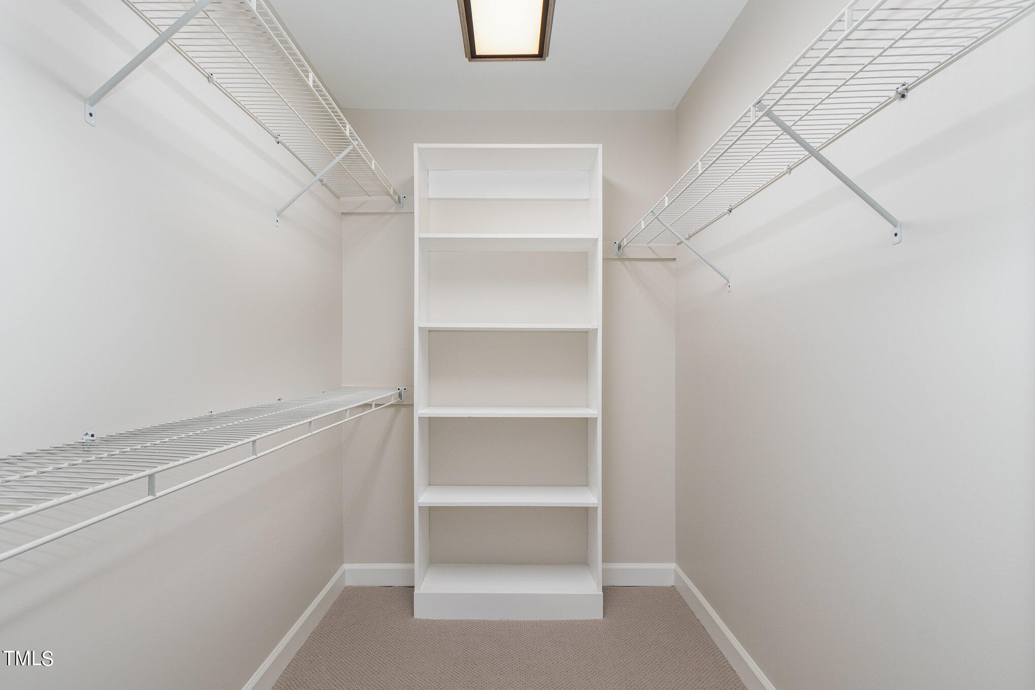 2008 Umstead Road Durham, NC 27712 - Photo 23 of 34 a view of walk in closet with empty racks