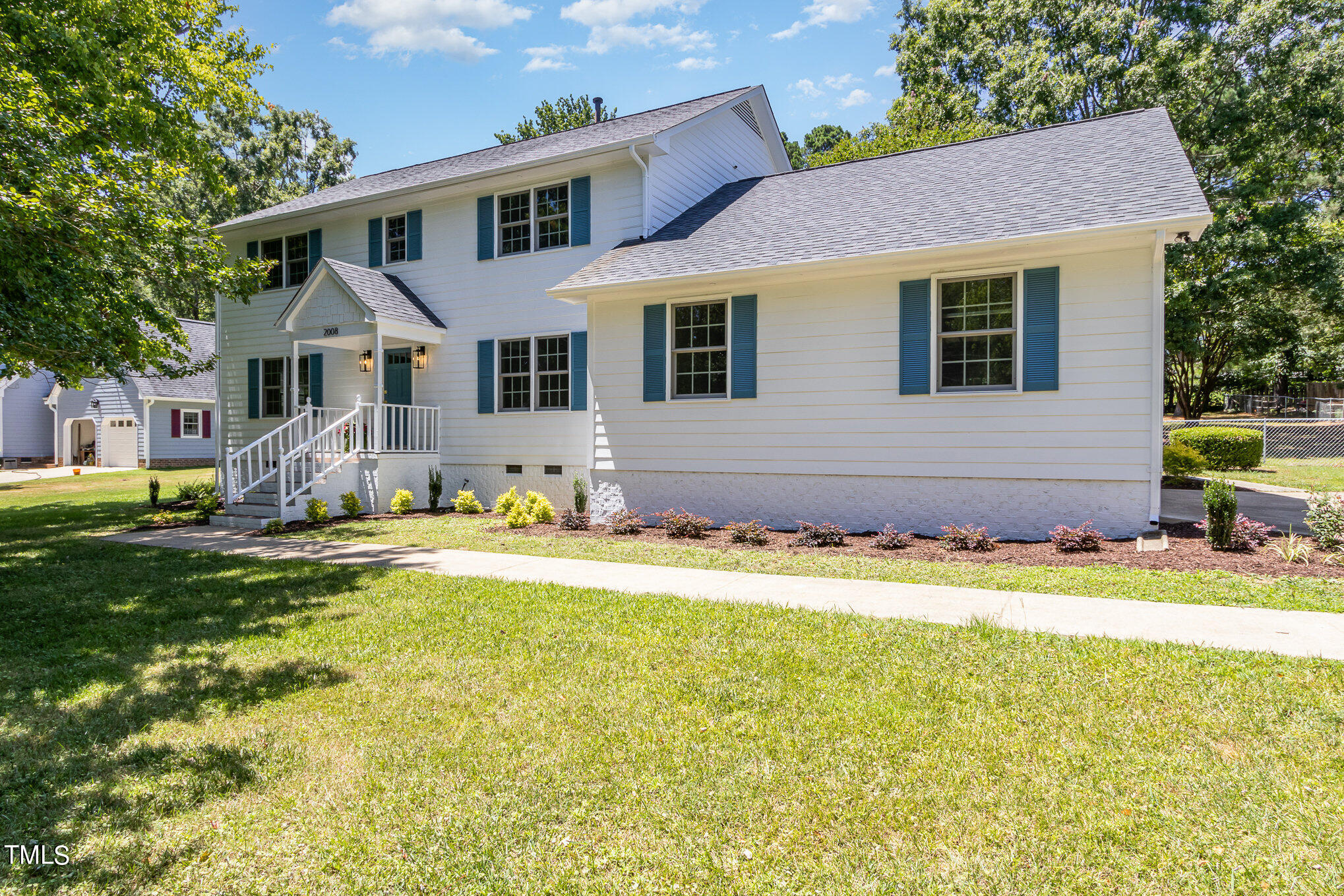 2008 Umstead Road Durham, NC 27712 - Photo 7 of 34 a front view of house with yard and trees around