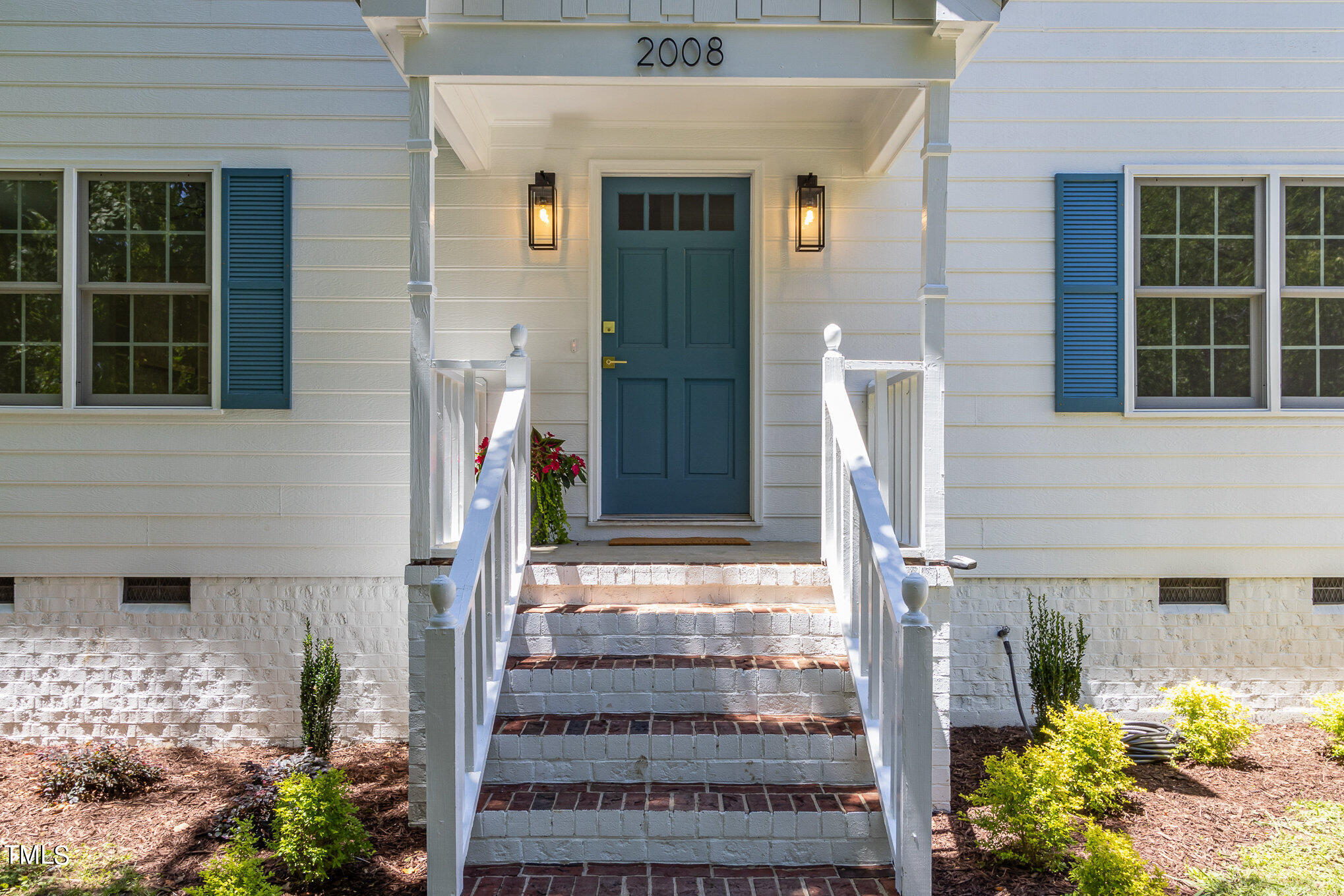 2008 Umstead Road Durham, NC 27712 - Photo 8 of 34 a front view of a house with a garden