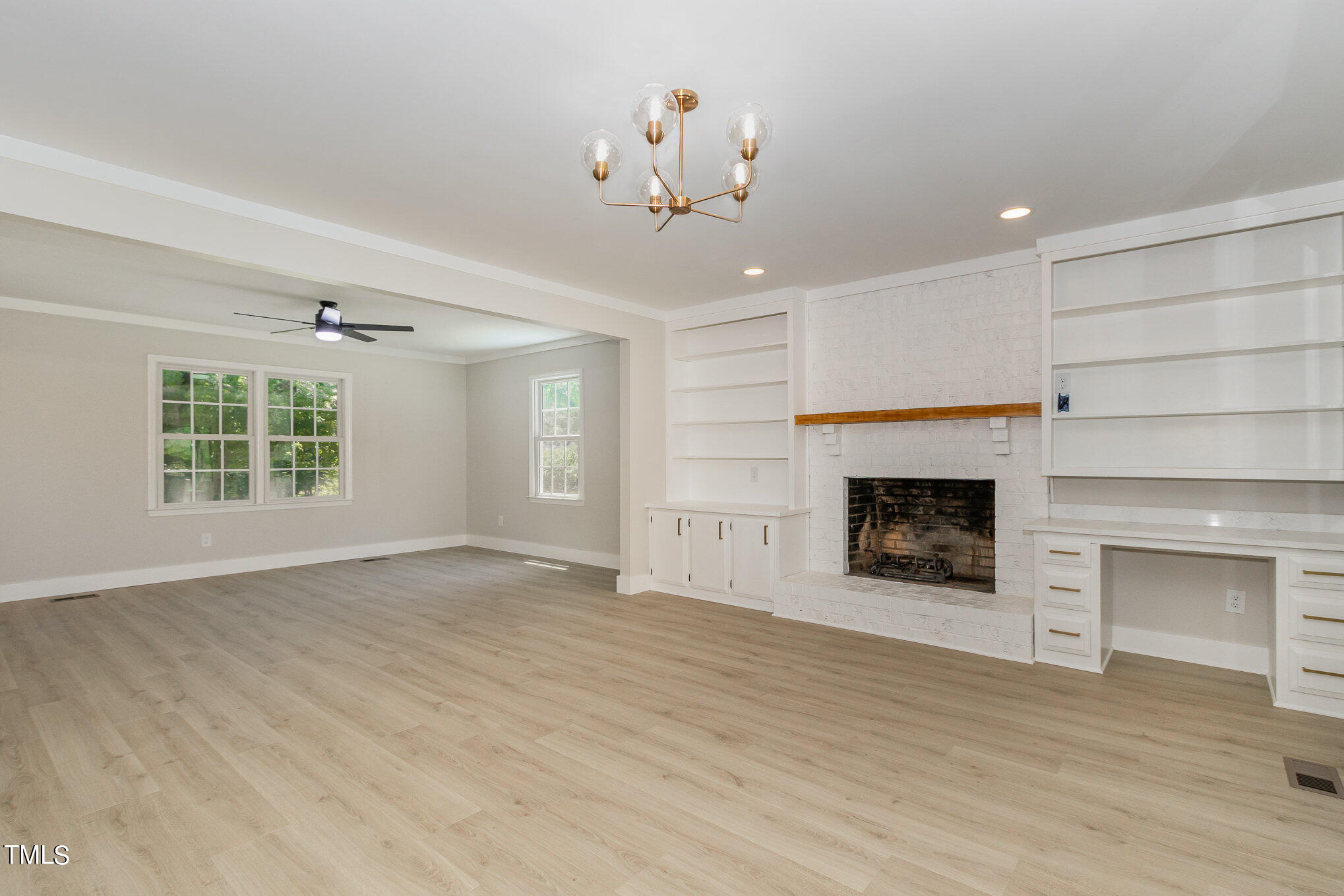 2008 Umstead Road Durham, NC 27712 - Photo 9 of 34 a view of an empty room with a fireplace and a window