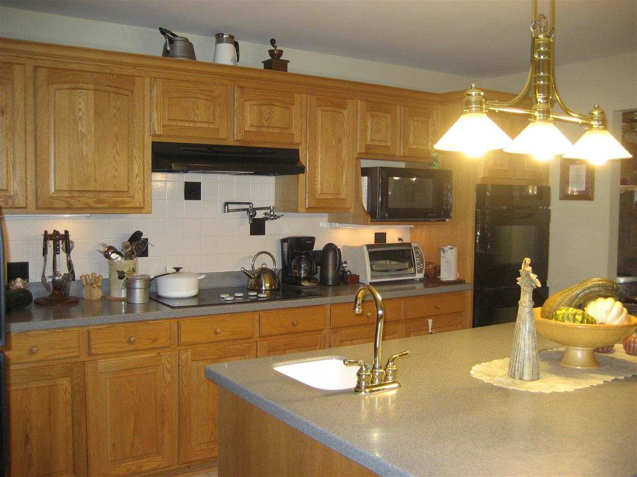 2401 South Watertown Road Oregon, IL 61061 - Photo 14 of 24 a kitchen with a sink and cabinets