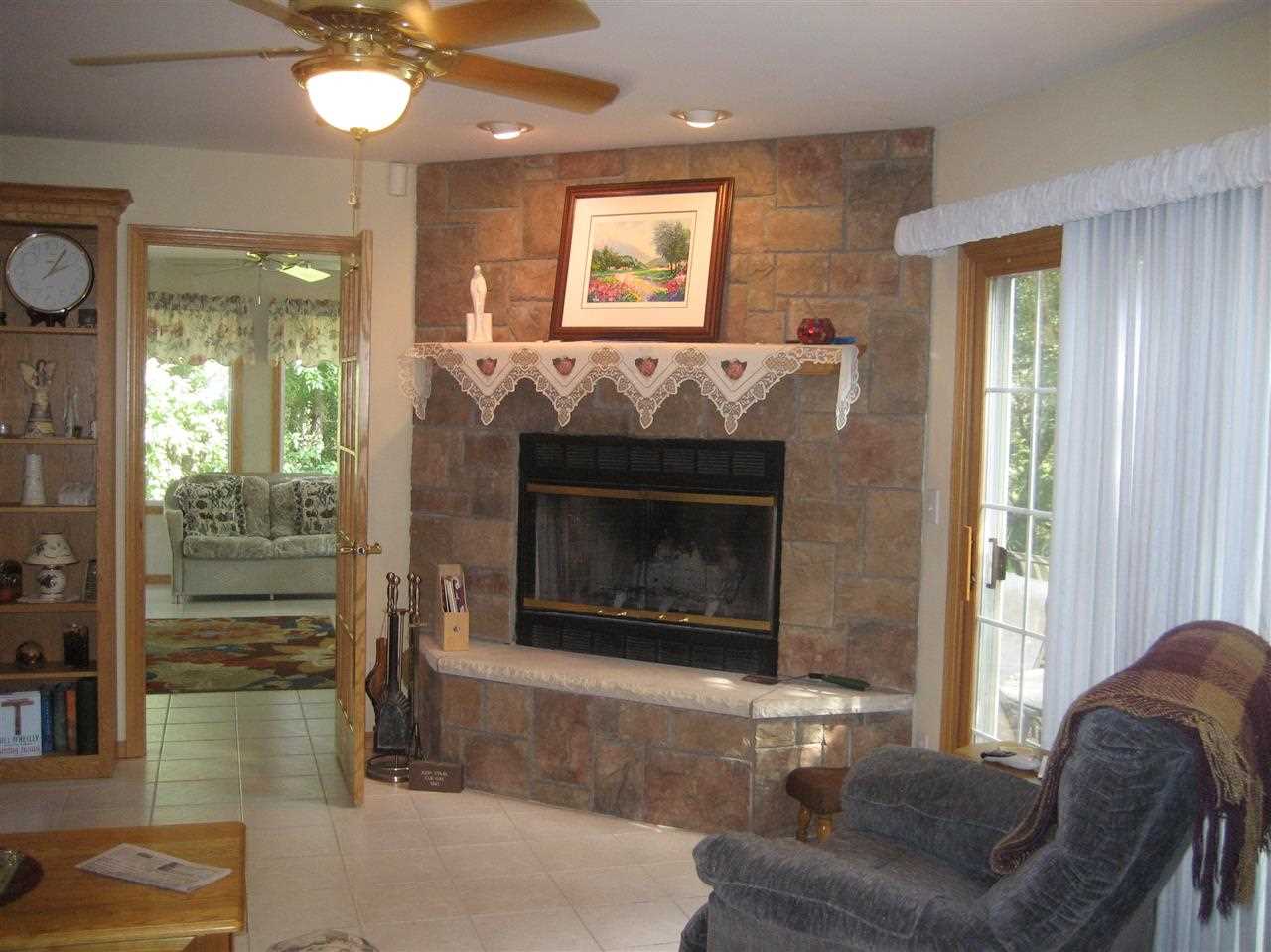 2401 South Watertown Road Oregon, IL 61061 - Photo 19 of 24 a living room with furniture and a fireplace