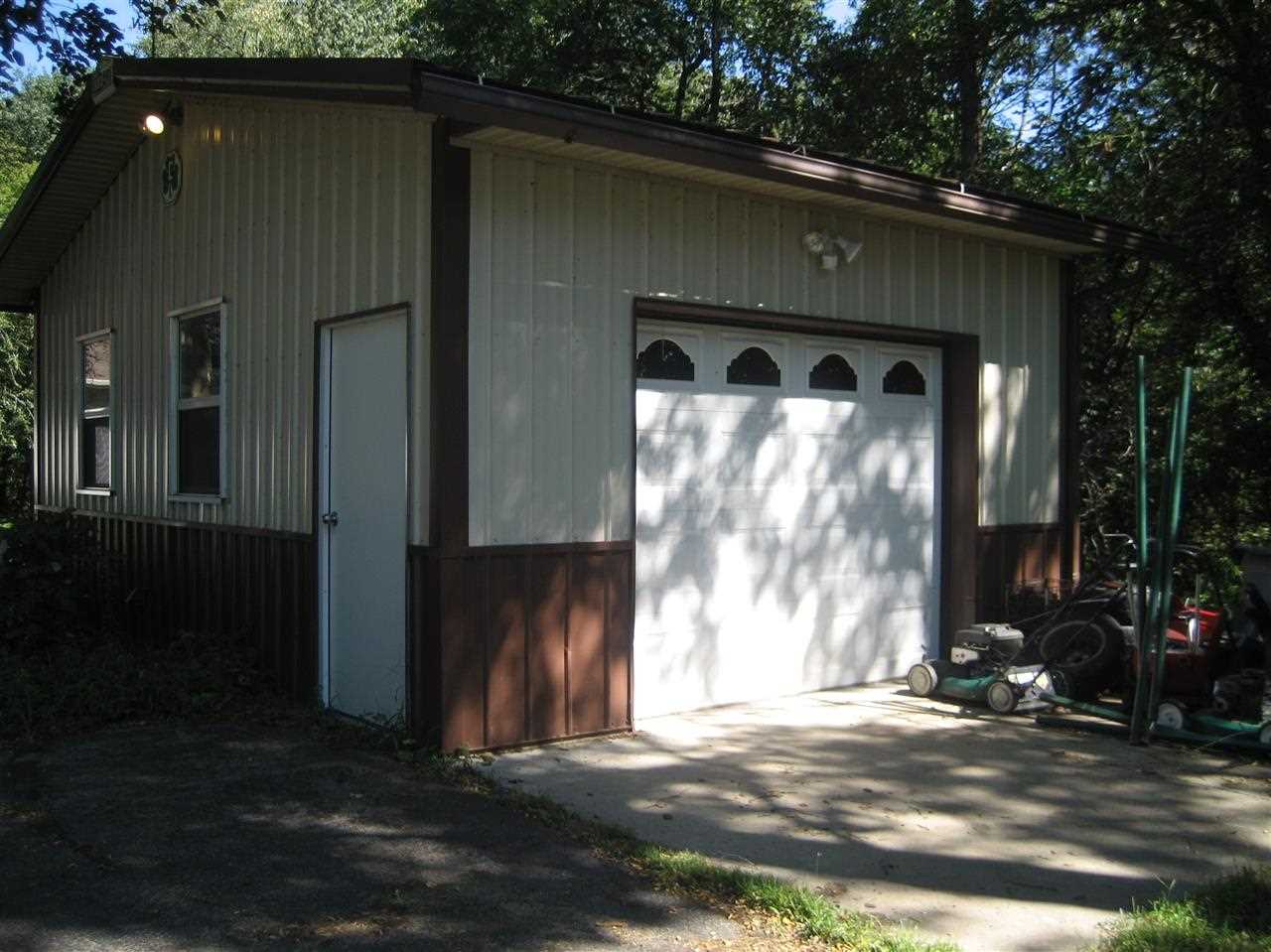 2401 South Watertown Road Oregon, IL 61061 - Photo 23 of 24 a front view of a house with a yard