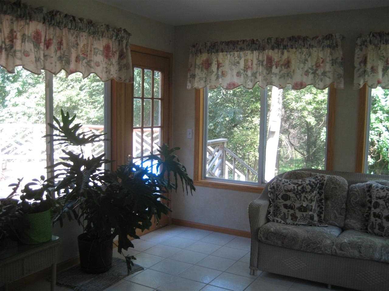 2401 South Watertown Road Oregon, IL 61061 - Photo 5 of 24 a living room with furniture and a large window