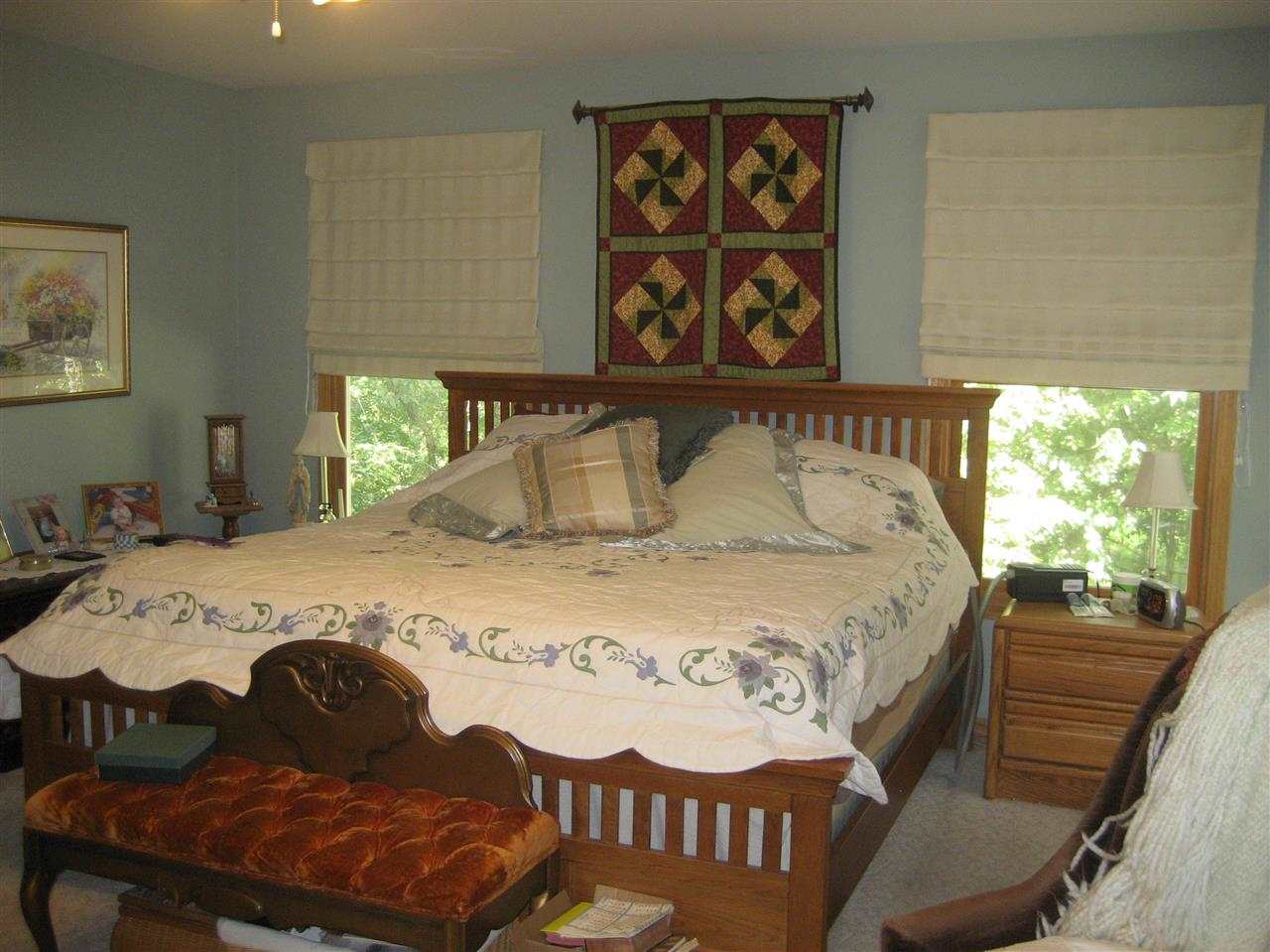 2401 South Watertown Road Oregon, IL 61061 - Photo 6 of 24 a bedroom with a bed and window