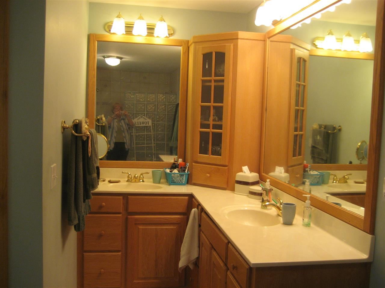 2401 South Watertown Road Oregon, IL 61061 - Photo 8 of 24 a bathroom with a sink double vanity and a mirror