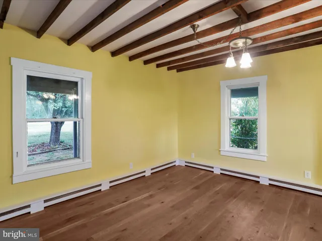 a view of an entryway with wooden floor