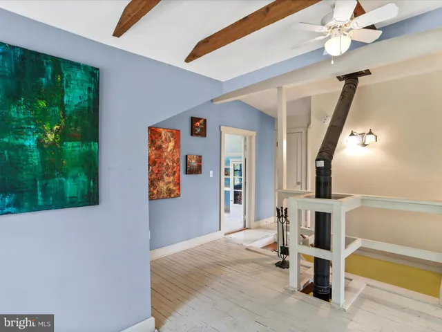 a view of a green field with an ocean view