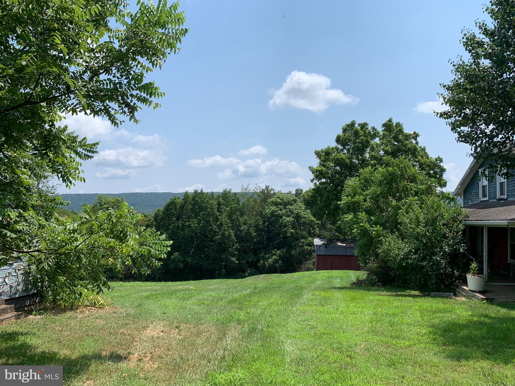 13108 Green Ridge Road Northeast Flintstone, MD 21530 - Photo 55 of 68 Left side yard between outbuilding and House