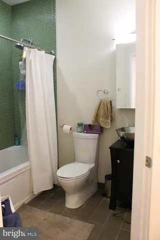 a bathroom with a sink and toilet