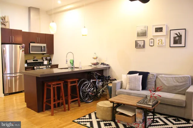 a kitchen with a sink cabinets and refrigerator