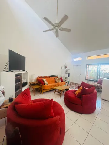 a room with furniture and a flat screen tv