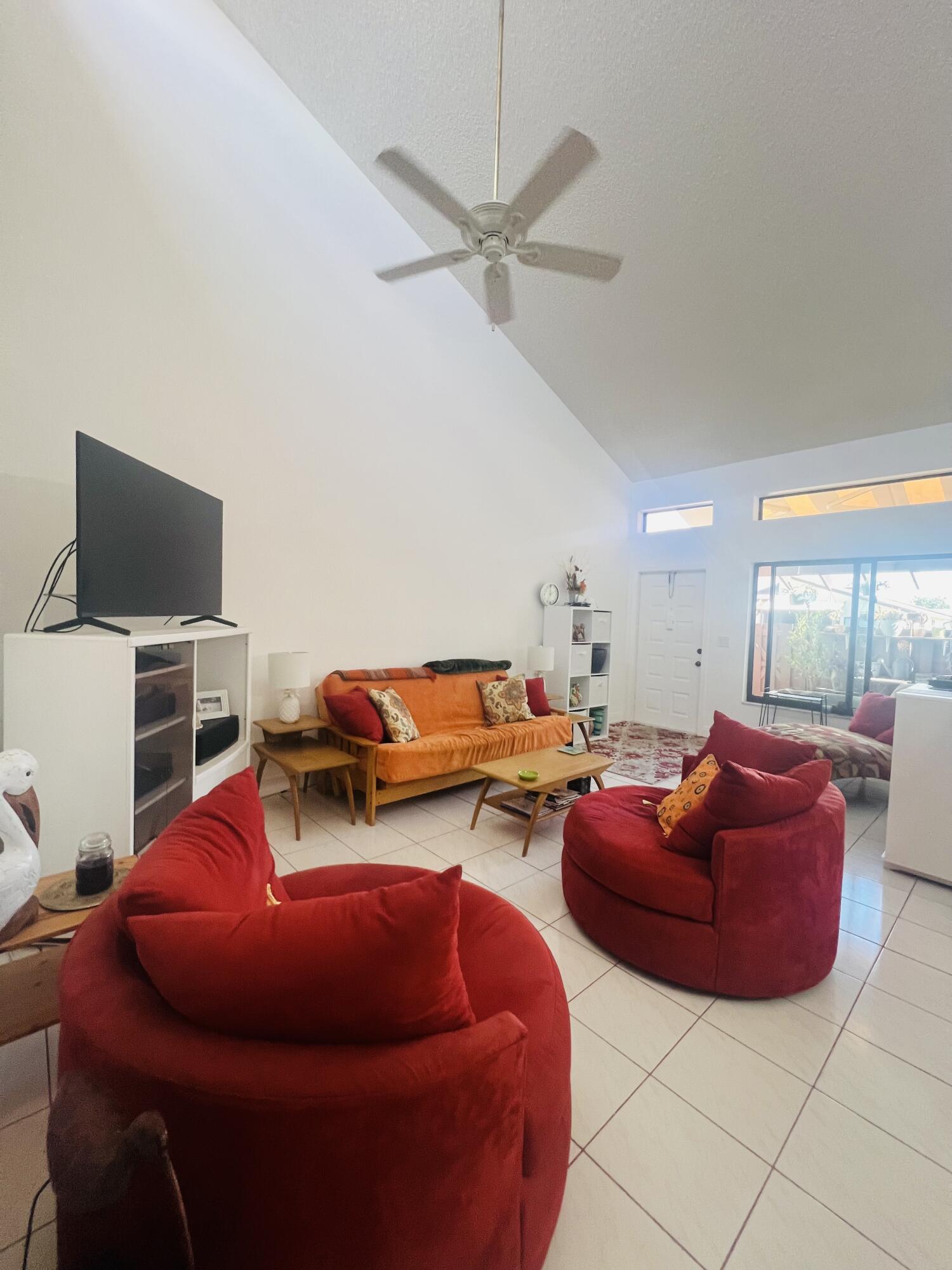 14109 Nesting Way Delray Beach, FL 33484 - Photo 5 of 12 a room with furniture and a flat screen tv