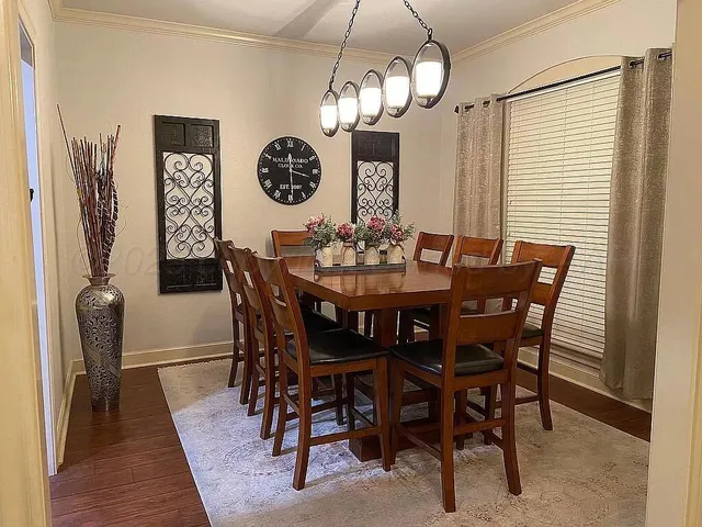 a view of a dining room with furniture and wooden floor